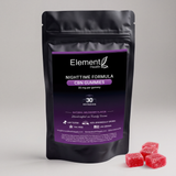 A black stand-up pouch of Element Health Nighttime Formula CBN Gummies with a purple label, shown on a light gray background with several red gummy candies in the foreground.